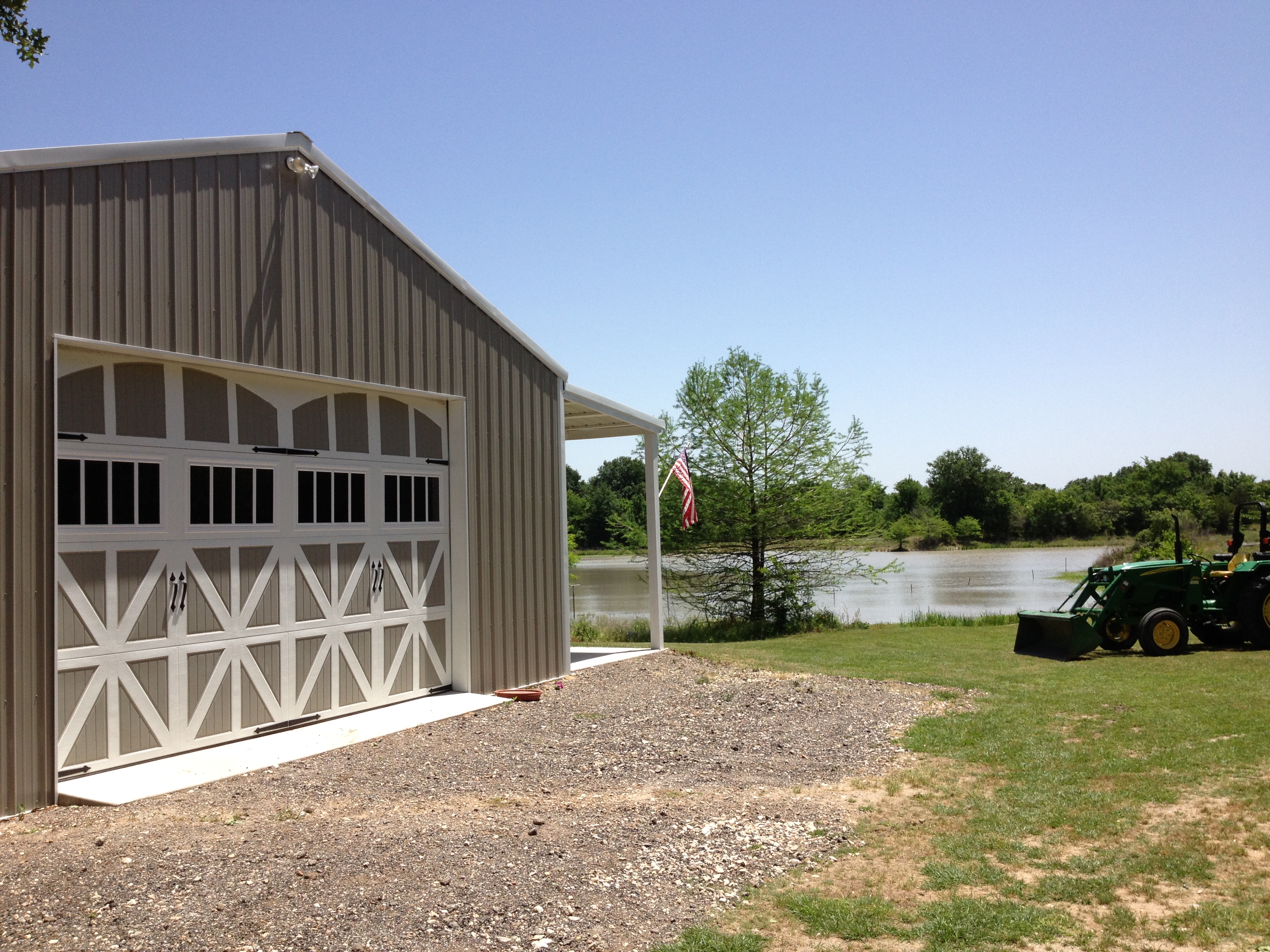 Amarr Classica garage doors come in solid, woodgrain, and two-tone colors.