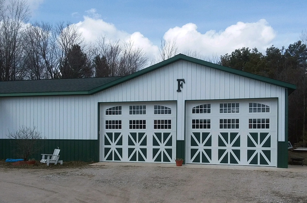 These Amarr Classica doors are one-of-a-kind - 14' h x 10'4" w with two rows of windows - and look great on this green and white barn! (c) Jay Freeland, Enterprise Door