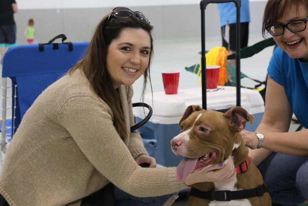 Sarah Workman, Entrematic People Department Generalist, is all smiles with Sydney, a dog from the Humane Society.
