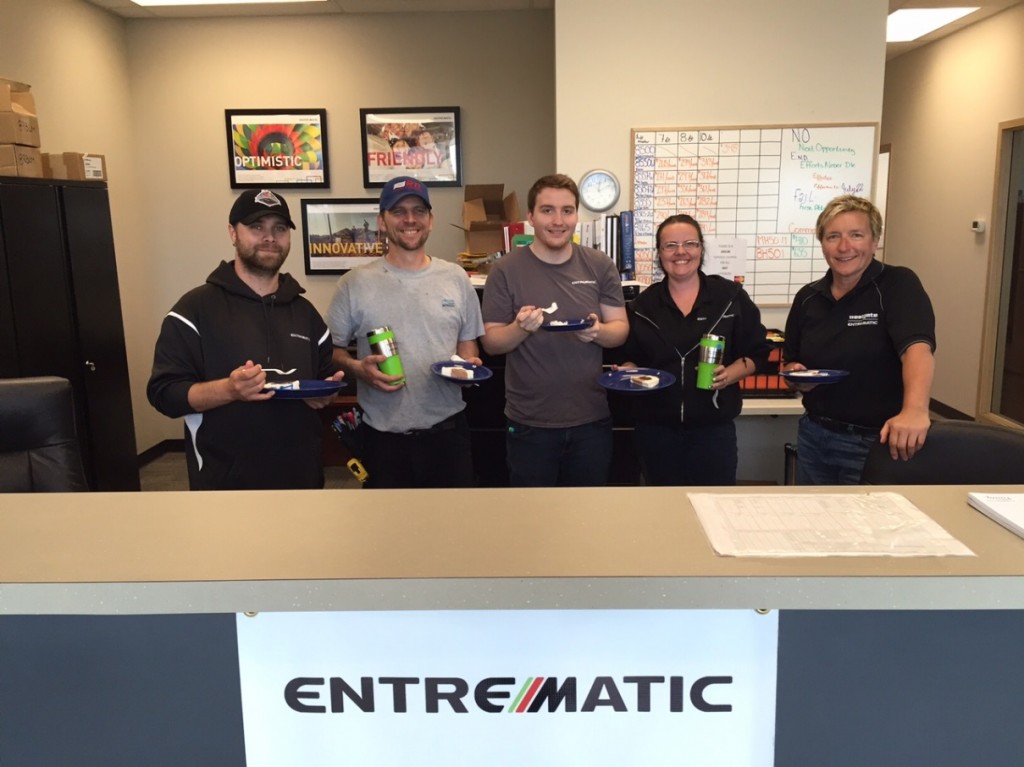 Our Edmonton Door Center Team Members took time to pose with their commemorative gifts and cake. Pictured from Left to Right: Brad Vestby, Office Assistant; Mike Deslauriers, Warehouse; Rob White, Warehouse; Cathy Coppick, Office Assistant; Darlene Holden, General Manager.