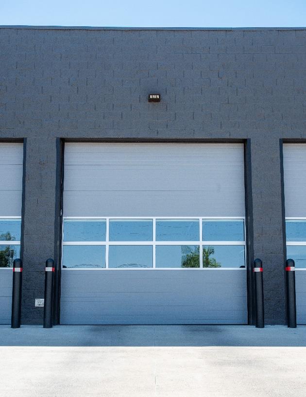 Steel sectional door with full-view panels installed at fire station