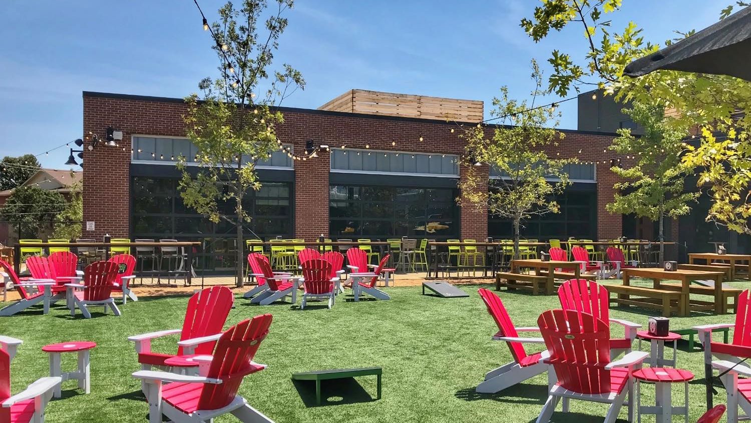 Casual dining outdoor space with chairs and open-air design at Chicken N Pickle