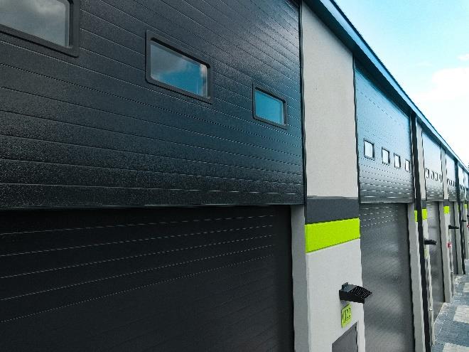 Custom steel sectional door with insulated header windows and modern design