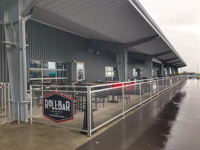 Outdoor patio with aluminum glass doors at racetrack hospitality venue