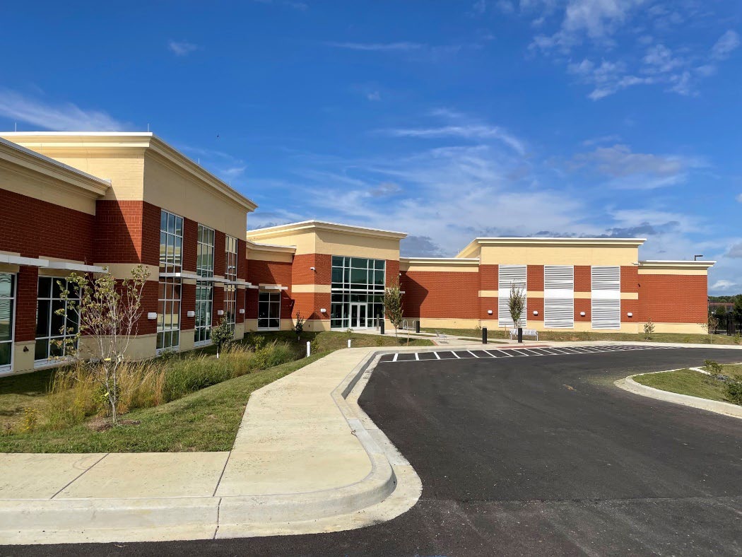 Electric utility facility building with modern design and overhead doors