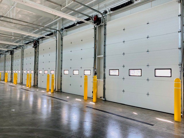 Interior truck bays with multiple steel sectional overhead doors