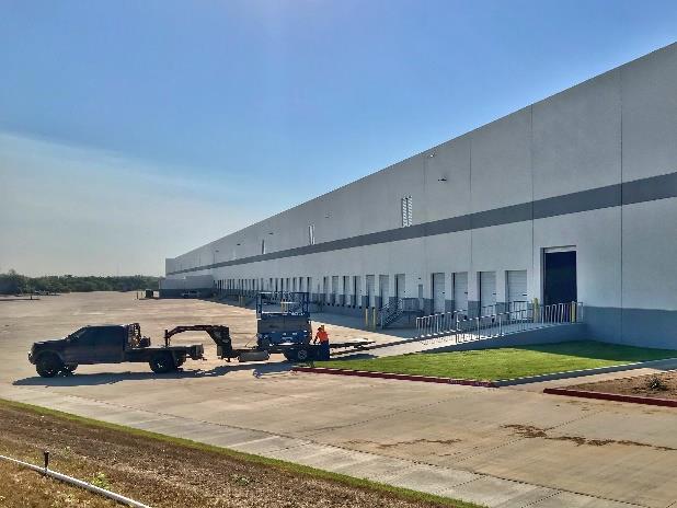 Exterior view of large industrial warehouse building in Texas