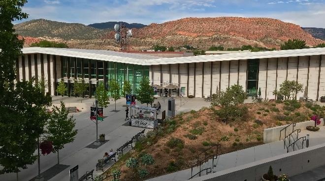 White rolling steel door integrated into building facade at university campus