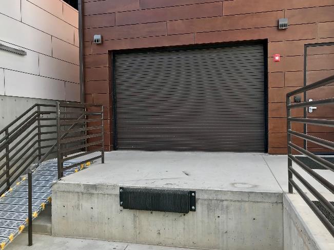 Service door for arts facility with minimal design and clean lines