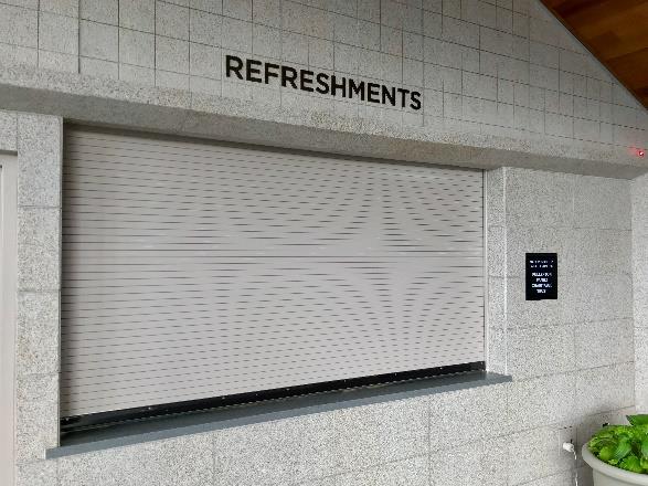 Interior concession stand with rolling counter door open for service