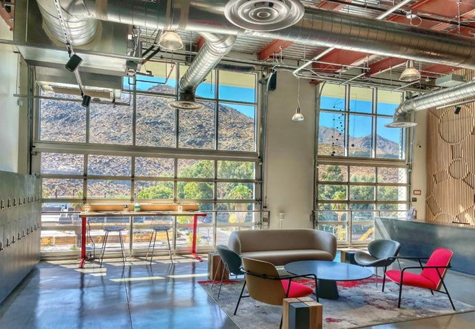 Interior lounge with full-view glass doors and mountain views in Palm Springs